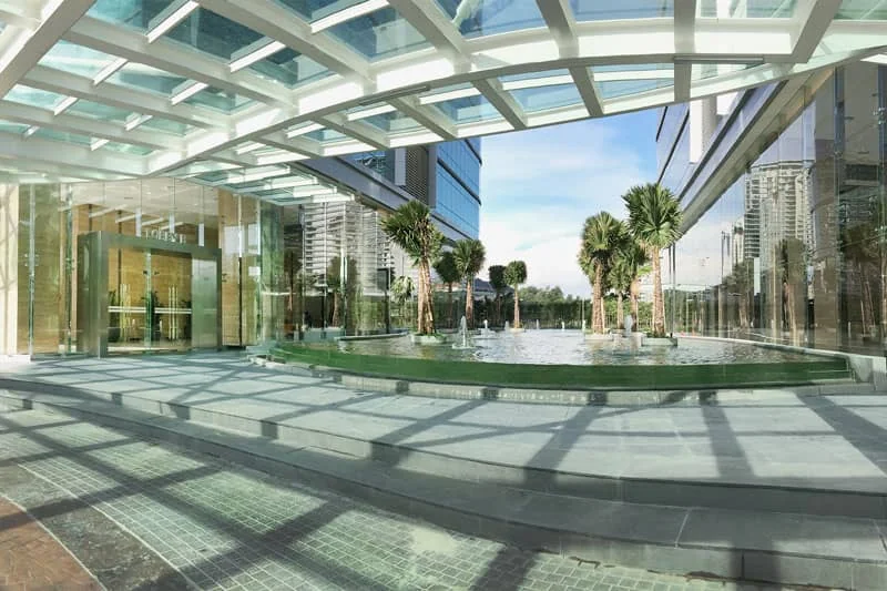 Covered pedestrian arrival beside The Vertical office towers in Bangsar South