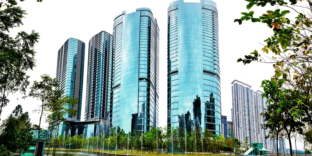 Curved glass exterior of UOA Corporate Tower in Bangsar South, Kuala Lumpur